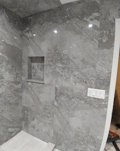 Large format stone tile shower
